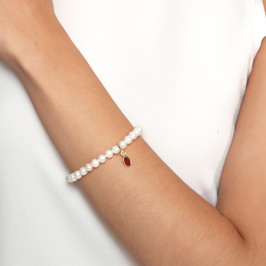 Pulseira-de-perolas-com-granada-e-topazio-branco-em-ouro-amarelo