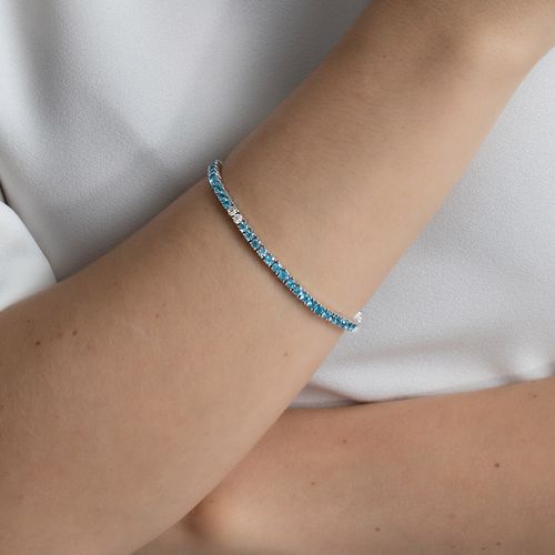 Pulseira riviera em ouro branco com topázios azuis e topázios brancos