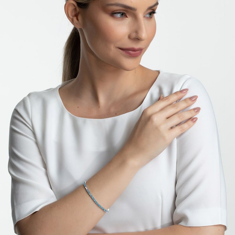 Pulseira-riviera-em-ouro-branco-com-topazios-azuis-e-topazios-brancos
